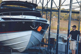 Boat cleaning at marina with man using boat wash mop aircraft, rv, boat, car